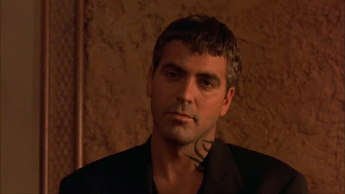A Man With A Tattoo On His Neck Is Wearing A Suit GIF