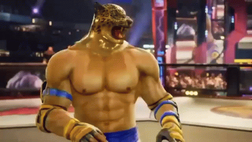 A Man With A Tiger Head Is Standing In A Boxing Ring In A Video Game . GIF