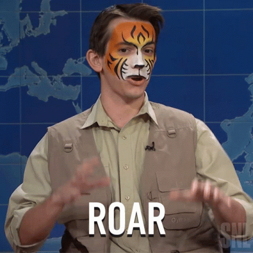 A Man With A Tiger Painted On His Face Has The Word Roar In Front Of Him GIF