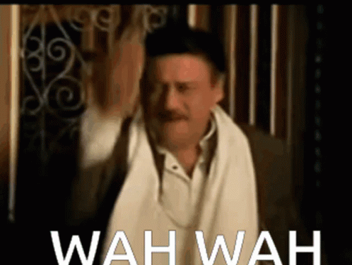 A Man With A Towel Around His Neck And The Words Wah Wah Written Below Him GIF