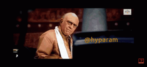 A Man With A Towel Around His Neck Is Making A Funny Face With The Words @Hyparam Below Him GIF