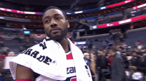 A Man With A Towel Around His Shoulder That Says Rade GIF