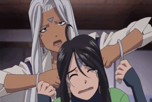 A Man With A Triangle On His Face Is Holding A Woman 'S Head GIF