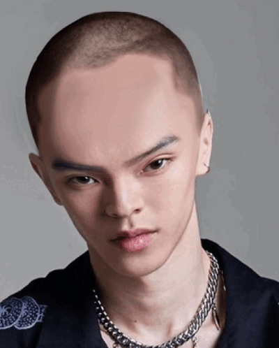 A Man With A Very Shaved Head And A Chain Around His Neck GIF