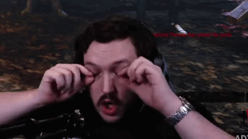 A Man With A Watch On His Wrist Is Making A Face With His Hands GIF