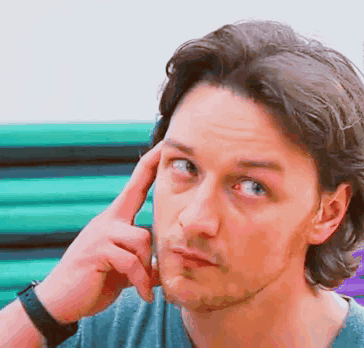A Man With A Watch On His Wrist Is Thinking GIF