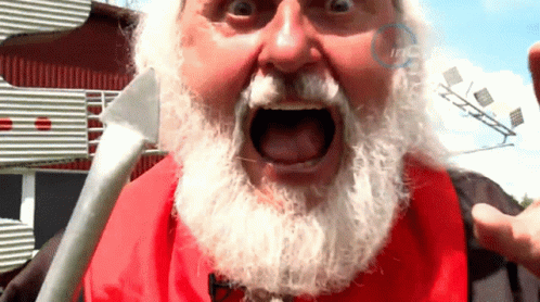 A Man With A White Beard And A Red Shirt Has His Mouth Wide Open GIF