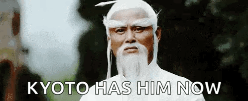 A Man With A White Beard And A White Wig Is Standing In Front Of A Tree And Says Kyoto Has Him Now GIF