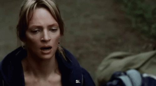 A Man With A White Beard And Eyebrows Looks At The Camera GIF