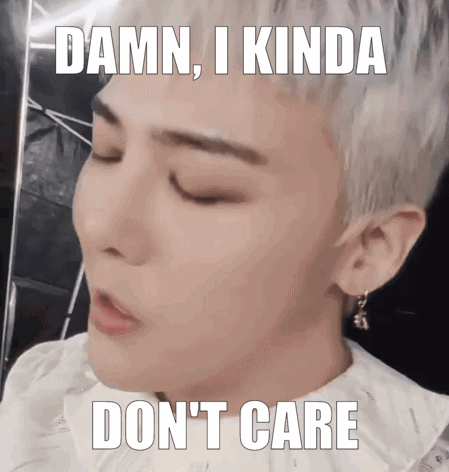 A Man With A White Shirt And Earrings Says Damn I Kinda Don 'T Care GIF