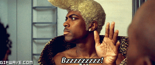 A Man With A Wig On Says Bzzzzzzz GIF