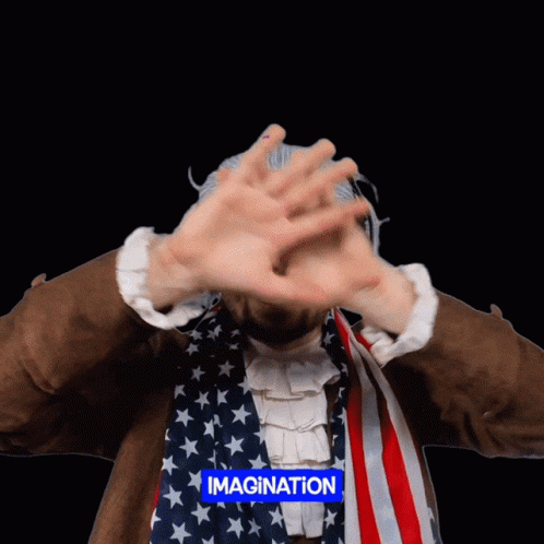 A Man With An American Flag Covering His Face With His Hands And The Word Imagination Above Him GIF