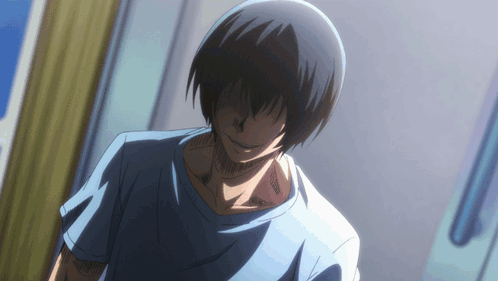 A Man With Black Hair And A Blue Shirt Is Standing In A Room GIF