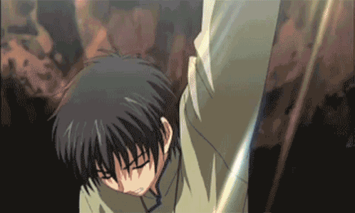 Man With Black Hair Holding Sword In Dark Room GIF