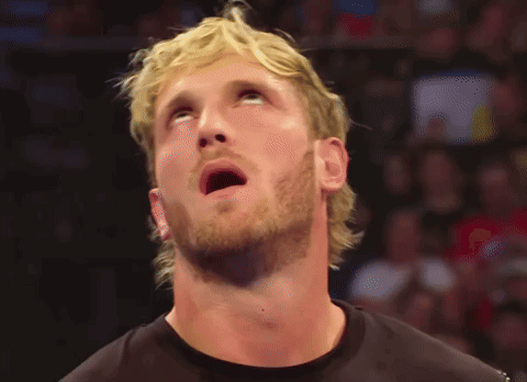 A Man With Blonde Hair And A Beard Is Looking Up At Something GIF