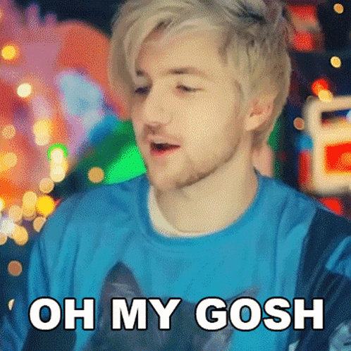 A Man With Blonde Hair And A Beard Is Wearing A Blue Shirt That Says Oh My Gosh GIF