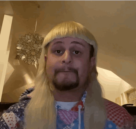 A Man With Blonde Hair And A Beard Is Wearing A Mullet GIF