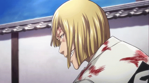 A Man With Blonde Hair And A White Shirt With The Letter F On The Back GIF