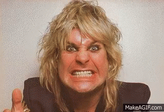 A Man With Blonde Hair Is Making A Very Angry Face . GIF