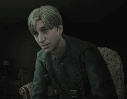 A Man With Blonde Hair Is Sitting In A Chair With His Eyes Closed GIF
