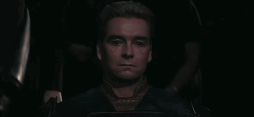 A Man With Blonde Hair Is Wearing A Blue Shirt GIF