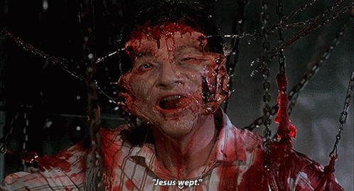 a man with blood on his face is chained to chains and says jesus wept