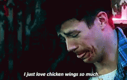 A Man With Blood On His Face Is Saying I Just Love Chicken Wings So Much . GIF