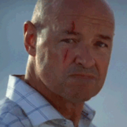 A Man With Blood On His Face Is Smiling GIF