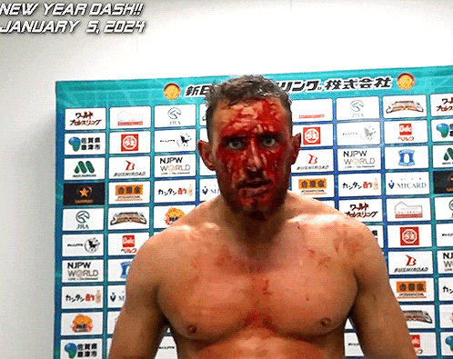 a man with blood on his face is standing in front of a sign that says new year dash january 5th 2024