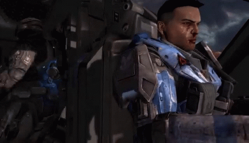 A Man With Blood On His Face Is Standing Next To Another Man With Blood On His Face GIF