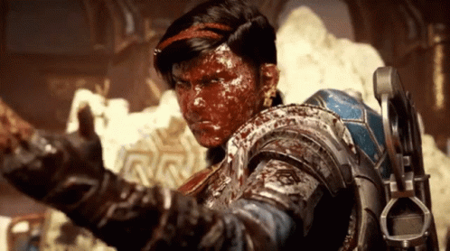 A Man With Blood On His Face Is Wearing A Blue Armor GIF