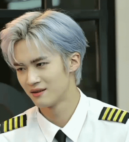 A Man With Blue Hair Is Wearing A White Shirt And Black Tie GIF
