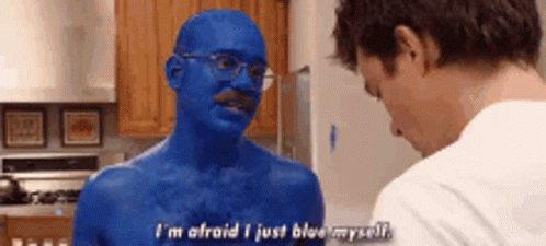 A Man With Blue Paint On His Body Is Talking To Another Man In A Kitchen . GIF