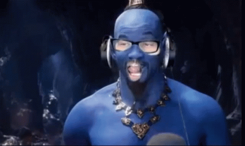 A Man With Blue Paint On His Face And Glasses GIF