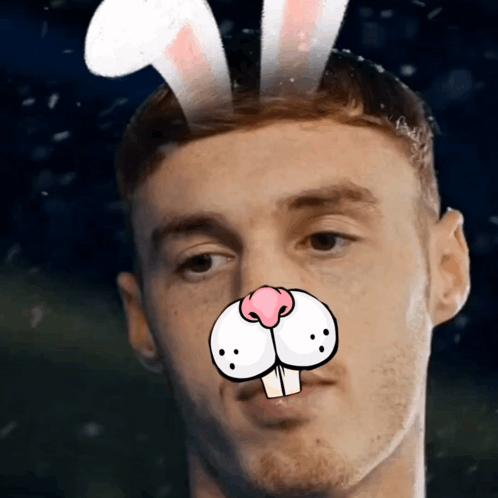 A Man With Bunny Ears On His Head And A Cartoon Nose GIF