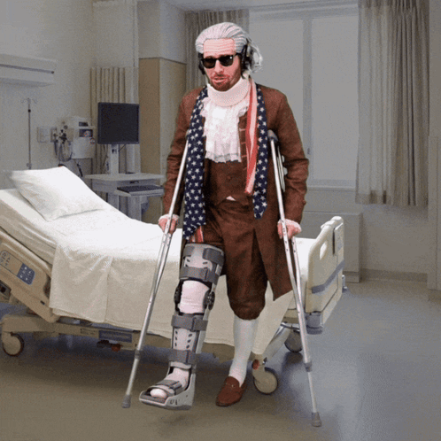 A Man With Crutches Standing In Front Of A Hospital Bed That Says ' Ec ' On It GIF