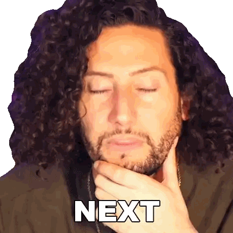 a man with curly hair and a beard has his hand on his chin and the word next is on the bottom of his face