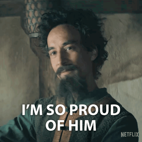 A Man With Curly Hair And A Beard Says " I 'M So Proud Of Him " GIF