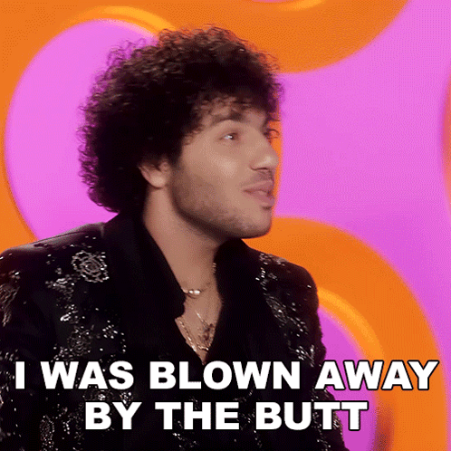 A Man With Curly Hair And A Beard Says I Was Blown Away By The Butt GIF