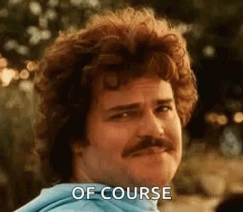 A Man With Curly Hair And A Mustache Is Making A Face And Saying `` Of Course '' . GIF