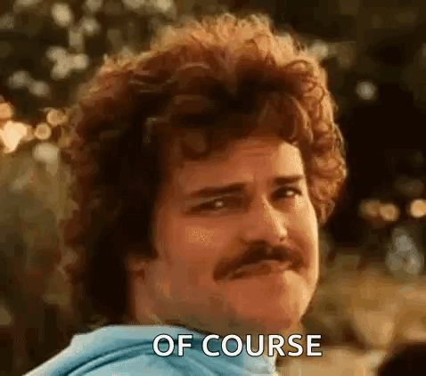 A Man With Curly Hair And A Mustache Is Making A Face And Saying `` Of Course '' . GIF