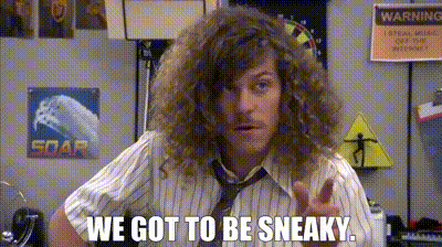 A Man With Curly Hair And A Tie Says " We Got To Be Sneaky " GIF
