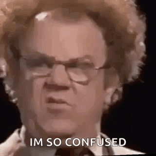 A Man With Curly Hair And Glasses Is Making A Funny Face . GIF