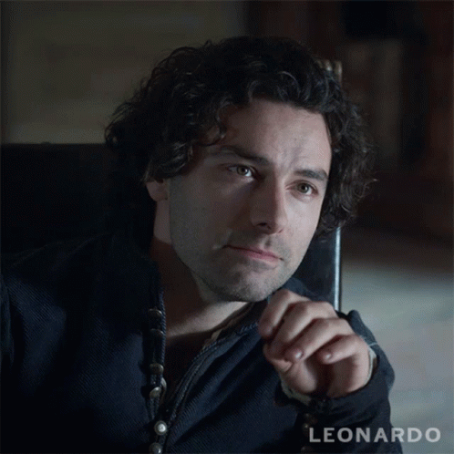 A Man With Curly Hair And The Name Leonardo On The Bottom Right GIF