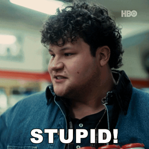 A Man With Curly Hair Is Holding A Can Of Soda And Saying Stupid GIF