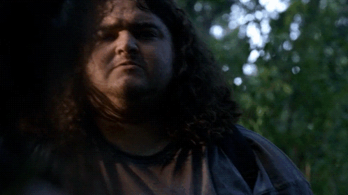 A Man With Curly Hair Is Smiling With The Words I Want Some Friggin Written Below Him GIF