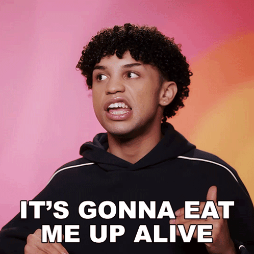 A Man With Curly Hair Says " It 'S Gonna Eat Me Up Alive " In Front Of A Pink Background GIF