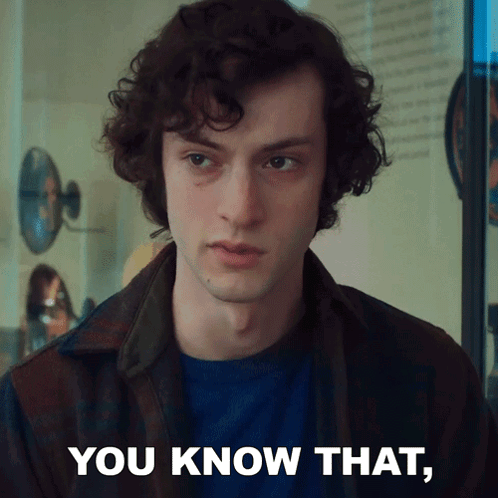 A Man With Curly Hair Says " You Know That " In Front Of A Mirror GIF