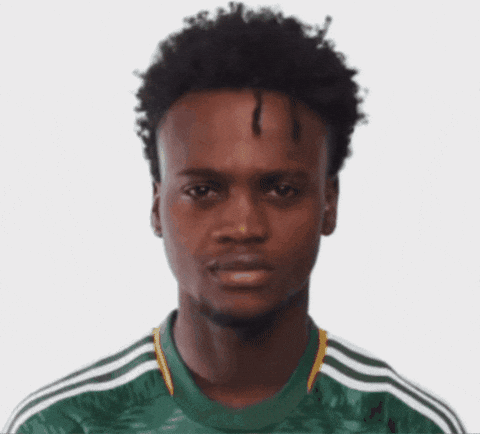 A Man With Curly Hair Wearing A Green Adidas Shirt GIF