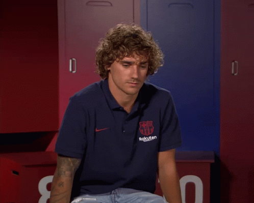 A Man With Curly Hair Wearing A Rakuten Polo Shirt GIF